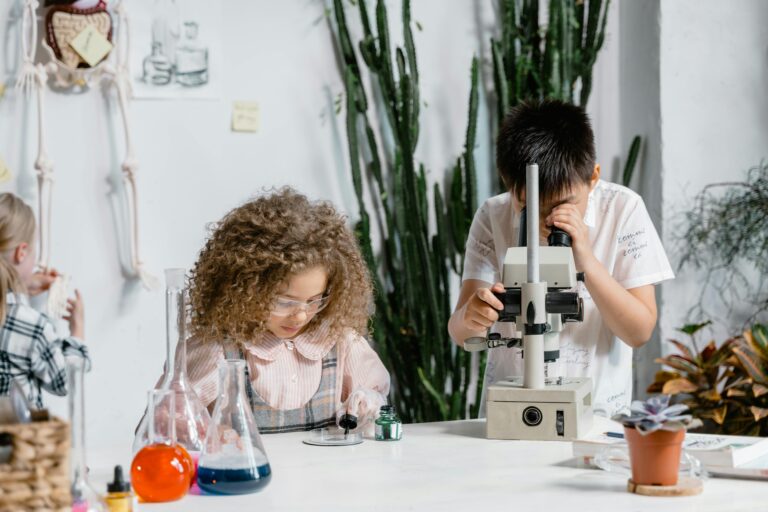 Kids STEM Project - credit: Photo by MART PRODUCTION: https://www.pexels.com/photo/woman-in-white-long-sleeve-shirt-holding-white-and-black-machine-8471984/