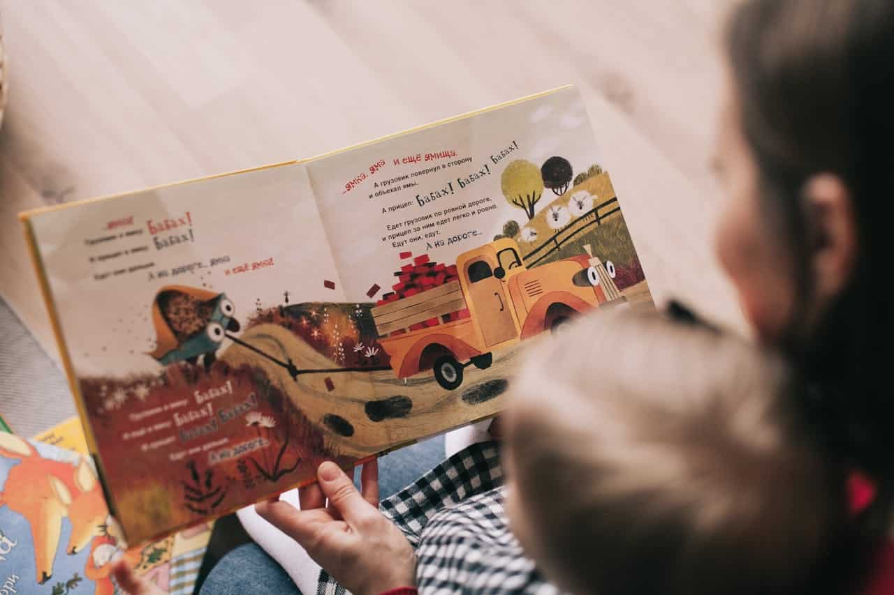 Photo by Lina Kivaka: https://www.pexels.com/photo/woman-reading-book-to-toddler-1741231/