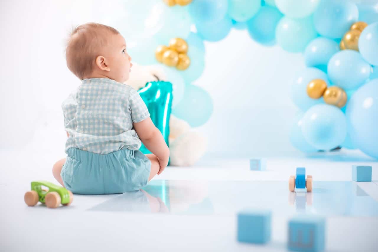 Photo by Norman Milwood: https://www.pexels.com/photo/a-toddler-celebrating-his-1st-birthday-27087179/